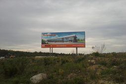 baner reklamowy - hala produkcyjno-magazynowa z budynkiem biurowym, dla Jota Group, Ostróda, warmińsko-mazurskie