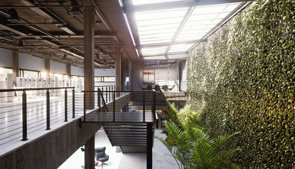 Wizualizacja wnętrza nowoczesnej hali Graffico z antresolą, wysoką zieloną ścianą roślinną, przeszklonym dachem i industrialną architekturą